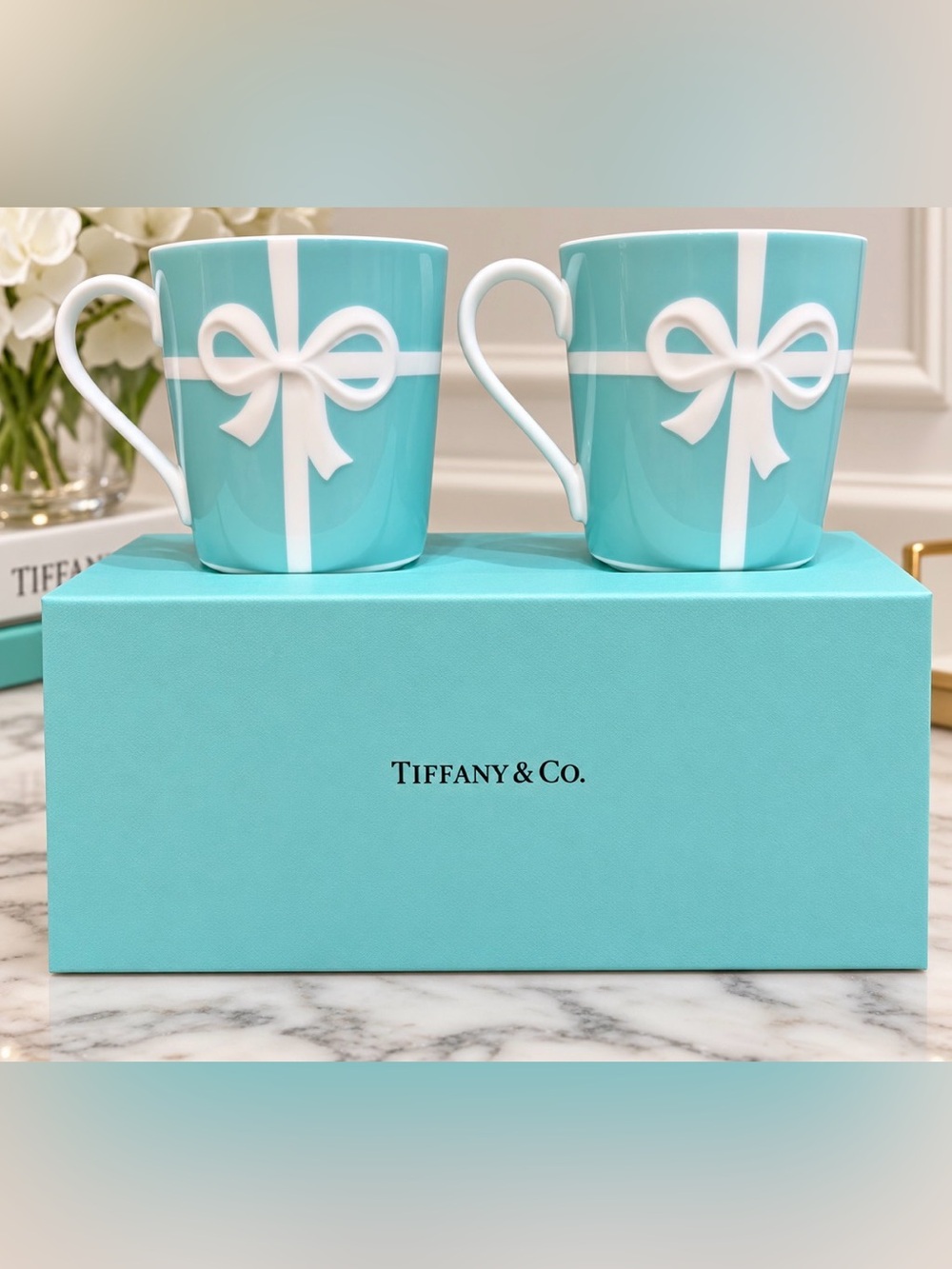 Tiffany & Co. Blue Porcelain Mug Set with White Bow Motif